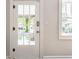 Bright entryway featuring a glass-paneled door, natural light, interior door hardware, and neutral wall paint at 5912 Evanston Ave, Indianapolis, IN 46220