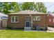 Brick home with charming backyard and easy access back door at 5912 Evanston Ave, Indianapolis, IN 46220