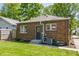 Brick home with charming backyard and easy access back door at 5912 Evanston Ave, Indianapolis, IN 46220