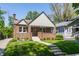 Charming brick home with a cozy front porch, landscaped yard, and inviting curb appeal at 5912 Evanston Ave, Indianapolis, IN 46220