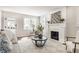 Well-lit living room showcasing modern decor, a fireplace, neutral furniture, an area rug, and a bright feel at 5912 Evanston Ave, Indianapolis, IN 46220