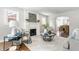 Comfortable living room featuring a fireplace, modern decor, an area rug, and archway to dining room at 5912 Evanston Ave, Indianapolis, IN 46220