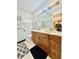 Bathroom featuring a double vanity, large mirror, and a shower/tub combination, providing space and comfort at 6335 Linden Dr, Indianapolis, IN 46227