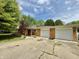 Ranch-style brick home with a two-car garage, front yard landscaping, and a concrete driveway at 6335 Linden Dr, Indianapolis, IN 46227