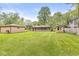 Overview of the property showcasing the house, detached garage, shed, and expansive backyard at 6401 N Oakland Ave, Indianapolis, IN 46220