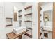 A bathroom featuring floating shelves and a modern vessel sink at 6401 N Oakland Ave, Indianapolis, IN 46220