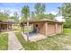 A detached two-car garage with a covered patio that includes outdoor seating and decor at 6401 N Oakland Ave, Indianapolis, IN 46220