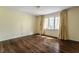 Sunny bedroom with hardwood floors and large windows at 7770 N Pennsylvania St, Indianapolis, IN 46240