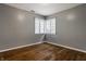 Bedroom with hardwood floors and a window with shutters at 7770 N Pennsylvania St, Indianapolis, IN 46240