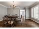 Traditional dining room with hardwood floors and a view into another room at 7770 N Pennsylvania St, Indianapolis, IN 46240
