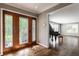Foyer featuring hardwood floors and decorative glass doors leading to a grand living space at 7770 N Pennsylvania St, Indianapolis, IN 46240
