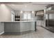 Updated kitchen featuring stainless steel appliances and a large center island at 7770 N Pennsylvania St, Indianapolis, IN 46240