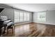 Bright living room featuring hardwood floors and natural light from the big windows at 7770 N Pennsylvania St, Indianapolis, IN 46240