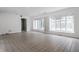 Spacious living room featuring tiled floors, large windows, and natural light at 7770 N Pennsylvania St, Indianapolis, IN 46240