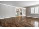 Open living room with hardwood floors leading to a kitchen at 7770 N Pennsylvania St, Indianapolis, IN 46240