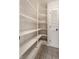 Walk-in pantry featuring shelving and a door at 7770 N Pennsylvania St, Indianapolis, IN 46240