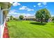 Expansive backyard features well-maintained lawn, mature trees, and a partial view of the rear home exterior at 8145 Bentley Farms Dr, Indianapolis, IN 46259