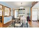 Bright dining room with modern decor, an open layout to the kitchen and a hardwood floor at 8145 Bentley Farms Dr, Indianapolis, IN 46259