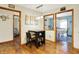 Cozy dining area featuring natural lighting, a dark wood table and easy access to kitchen and bedroom at 8145 Bentley Farms Dr, Indianapolis, IN 46259