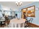 Bright dining area featuring a round table, open views to the kitchen and living room at 8145 Bentley Farms Dr, Indianapolis, IN 46259
