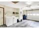 Clean, bright garage with a laundry sink, washer, dryer hookups, and automatic door opener at 8145 Bentley Farms Dr, Indianapolis, IN 46259