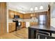 Functional kitchen featuring stainless steel appliances, ample counter space, and abundant cabinet storage at 8145 Bentley Farms Dr, Indianapolis, IN 46259