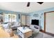 Cozy living room with a comfortable sofa, a modern coffee table, and calming blue walls at 8145 Bentley Farms Dr, Indianapolis, IN 46259