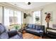 Relaxing living room featuring ample natural light, comfortable sofa, and tastefully decorated space at 8145 Bentley Farms Dr, Indianapolis, IN 46259
