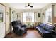 Cozy living room with natural light, comfortable seating, and a ceiling fan for added comfort at 8145 Bentley Farms Dr, Indianapolis, IN 46259