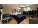 Bedroom with warm lighting, a large bed, and modern decorations on the walls at 8507 Promontory Rd, Indianapolis, IN 46236