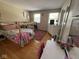 Bedroom with a playful bed setup, hardwood floors, and natural light at 8507 Promontory Rd, Indianapolis, IN 46236