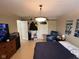 Bright bedroom featuring a large bed, a cozy sitting area, and ample closet space at 8507 Promontory Rd, Indianapolis, IN 46236