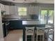 Functional kitchen space with center island, and a window providing natural light at 8507 Promontory Rd, Indianapolis, IN 46236