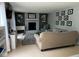 Comfortable living room features a brick fireplace, neutral decor, and ample seating at 8507 Promontory Rd, Indianapolis, IN 46236