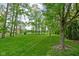 Lush green backyard with mature trees and well-maintained lawn space at 863 N Park Trail Dr, Carmel, IN 46032