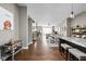 Open-concept living space featuring hardwood floors, dining area, and comfortable furniture at 863 N Park Trail Dr, Carmel, IN 46032