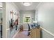 Bright and functional home office featuring natural light, built-in desk, and closet at 8636 Rockville Rd, Indianapolis, IN 46234