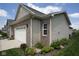 Close-up view showing the home's brick and siding, along with landscaping, and attached garage at 934 Steel Horse Dr, Westfield, IN 46074