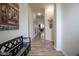Bright and inviting hallway featuring modern decor, wood flooring, and an open view of the living spaces at 934 Steel Horse Dr, Westfield, IN 46074