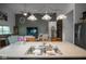 Stylish kitchen island with a double sink, modern faucet, and a view into the inviting living room area at 934 Steel Horse Dr, Westfield, IN 46074
