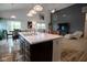 Modern kitchen with a large island, stylish lighting, and an open layout to the dining and living areas at 934 Steel Horse Dr, Westfield, IN 46074