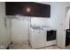 Modern laundry room equipped with a washing machine, dryer, and overhead storage cabinets for convenience at 934 Steel Horse Dr, Westfield, IN 46074