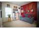 Cozy living room featuring a comfortable sofa, unique decor, and ample natural light from a window at 934 Steel Horse Dr, Westfield, IN 46074