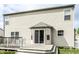 Exterior back view of home featuring a spacious deck with a cozy seating area for outdoor relaxation at 941 Pine Ridge Way, Brownsburg, IN 46112