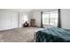 Inviting bedroom with a rocking chair, large window, and soft carpeting at 941 Pine Ridge Way, Brownsburg, IN 46112