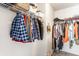 Organized walk-in closet with ample hanging space and shelving for storage at 941 Pine Ridge Way, Brownsburg, IN 46112