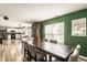 Open dining area connects to the kitchen, featuring a large table and modern decor at 941 Pine Ridge Way, Brownsburg, IN 46112