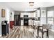 Modern kitchen with white cabinetry, stainless steel appliances, and a cozy breakfast nook at 941 Pine Ridge Way, Brownsburg, IN 46112