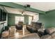 Inviting living room with multiple seating options, wood-look floors, and a view of the entryway at 941 Pine Ridge Way, Brownsburg, IN 46112