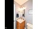 Charming half bathroom features a vanity with sink and a quirky 'Get Naked' sign at 941 W Barouche, Pendleton, IN 46064